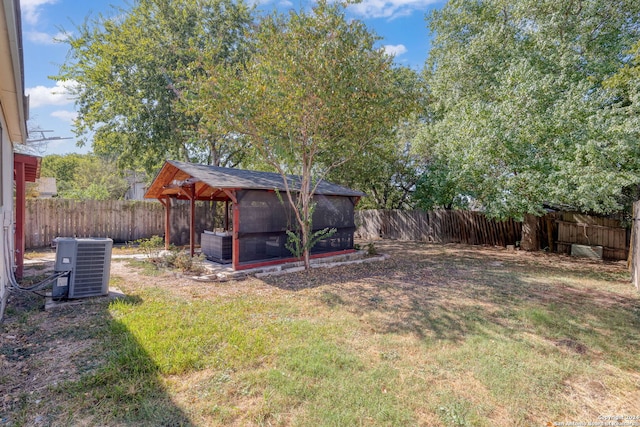 view of yard featuring central air condition unit and a gazebo