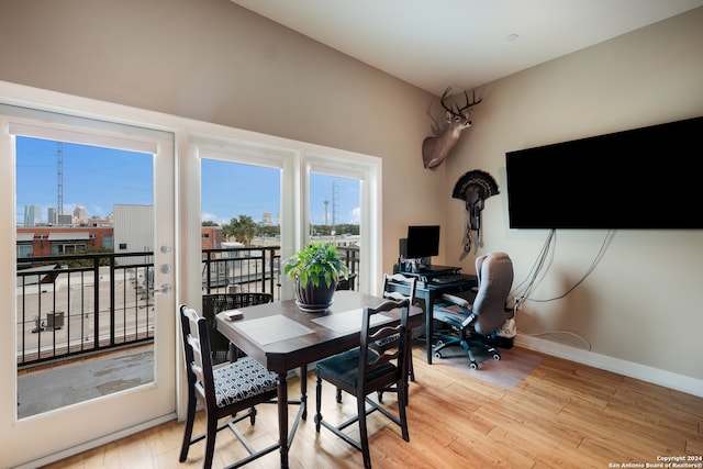 dining space with light hardwood / wood-style floors