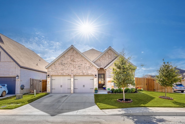 view of front facade with a front lawn and a garage