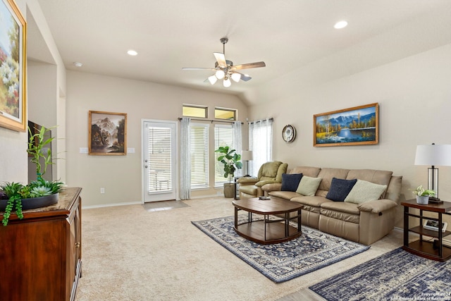 living room featuring lofted ceiling, light carpet, and ceiling fan