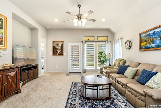 living room featuring light carpet, vaulted ceiling, and ceiling fan