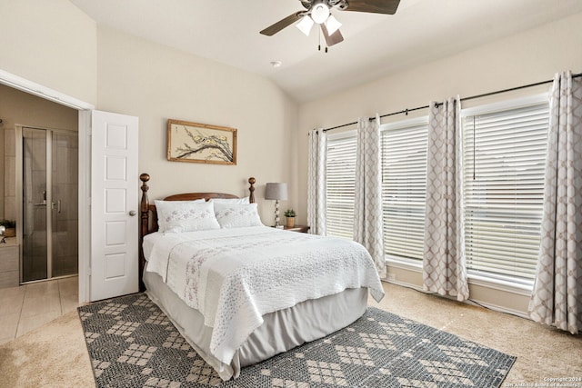 carpeted bedroom featuring vaulted ceiling, multiple windows, and ceiling fan