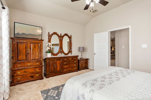 bedroom with ceiling fan, light carpet, and lofted ceiling