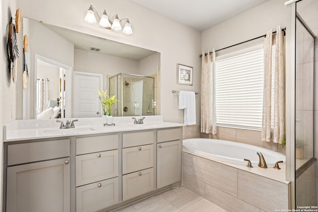 bathroom with vanity, tile patterned floors, and separate shower and tub