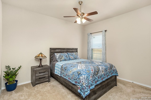 bedroom with ceiling fan and carpet flooring