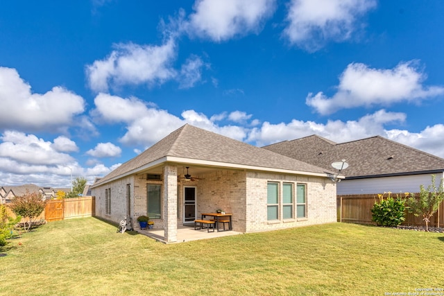 rear view of house featuring a patio area, a lawn, and ceiling fan