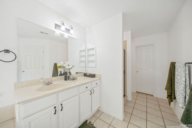 bathroom with tile patterned flooring and vanity