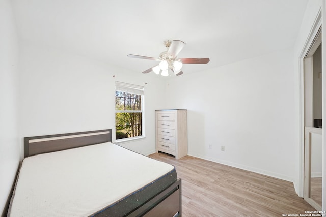 bedroom featuring ceiling fan and light hardwood / wood-style flooring