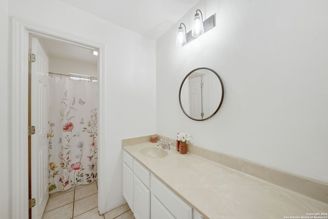 bathroom featuring a shower with curtain, tile patterned flooring, and vanity