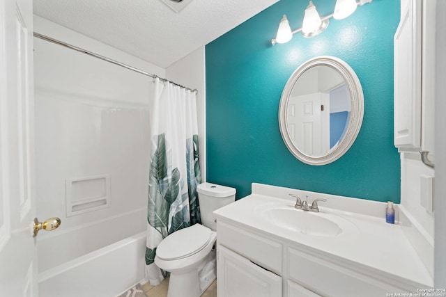 full bathroom with vanity, shower / bath combo with shower curtain, a textured ceiling, and toilet