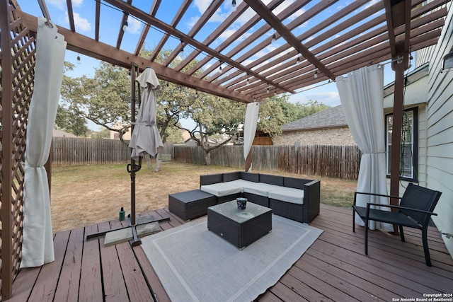 wooden deck with an outdoor hangout area and a pergola