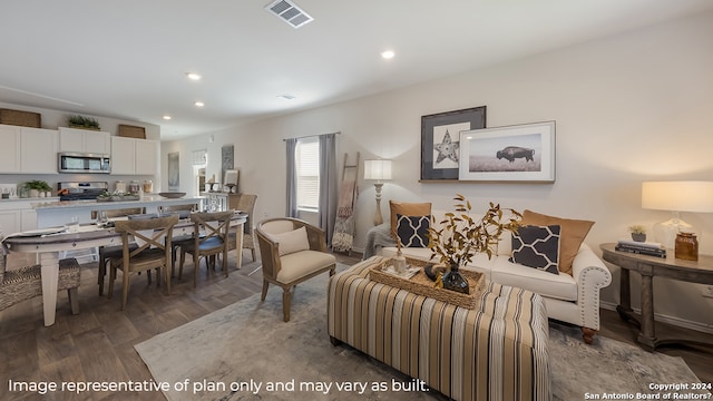 living room with dark hardwood / wood-style flooring