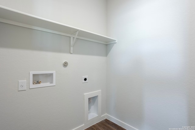 laundry area featuring dark wood-type flooring, washer hookup, electric dryer hookup, and hookup for a gas dryer