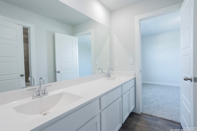 bathroom with hardwood / wood-style flooring and vanity