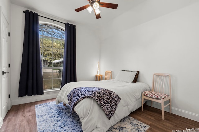 bedroom with dark wood-type flooring and ceiling fan