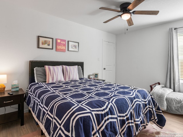 bedroom with hardwood / wood-style flooring and ceiling fan