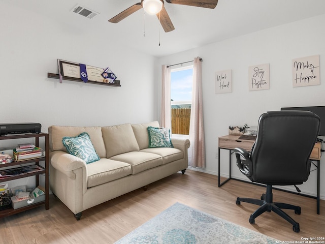 office with wood-type flooring and ceiling fan