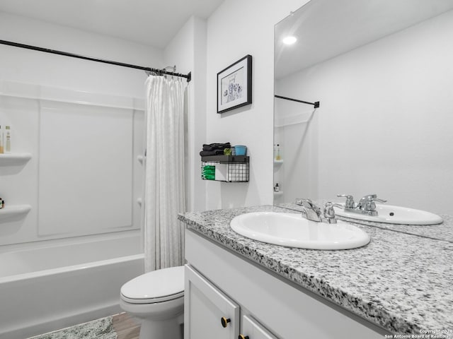 full bathroom with vanity, hardwood / wood-style floors, toilet, and shower / bathtub combination with curtain