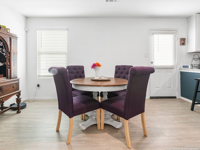 dining area with light hardwood / wood-style floors