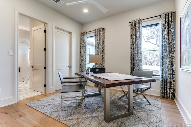 office area with light hardwood / wood-style floors and ceiling fan