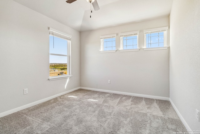 spare room featuring ceiling fan and carpet floors