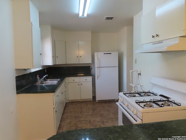 kitchen featuring white cabinetry, white appliances, and sink