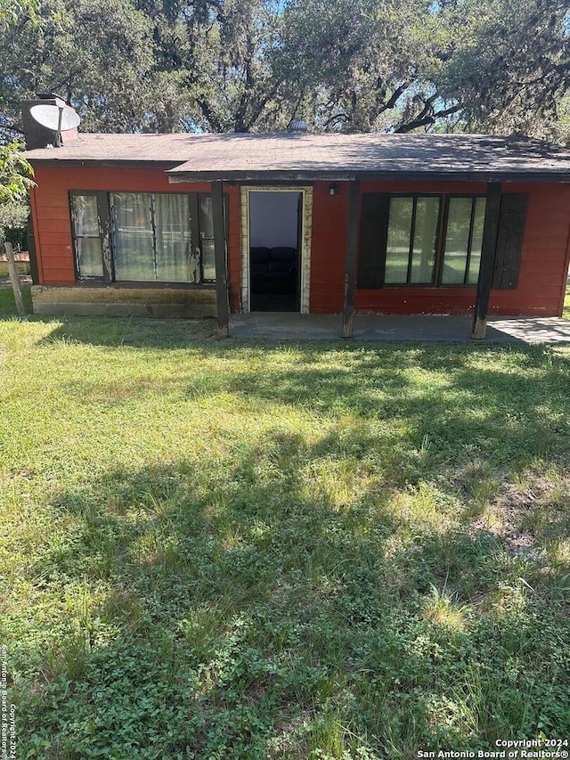 exterior space with a yard and a patio area