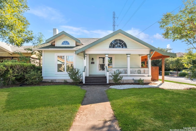 bungalow-style home with a porch and a front yard