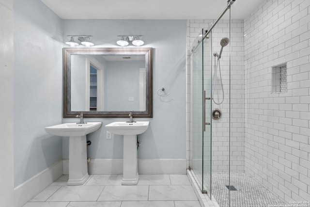 214 Loretta Pl, San Antonio, TX 78210 - full bath with a stall shower, baseboards, marble finish flooring, and a sink