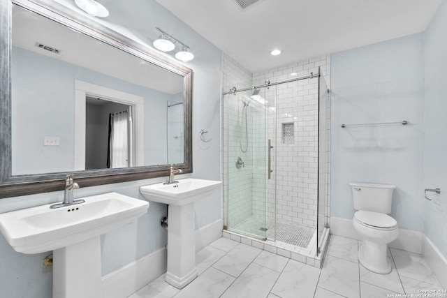 bathroom featuring walk in shower and toilet