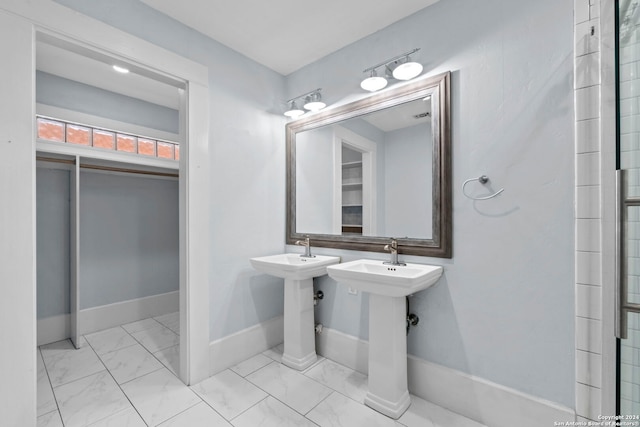 214 Loretta Pl, San Antonio, TX 78210 - bathroom with marble look tiles and baseboards