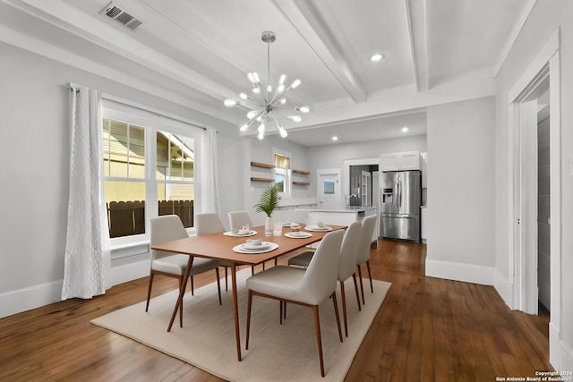 dining space with beam ceiling, crown molding, dark wood-type flooring, and an inviting chandelier