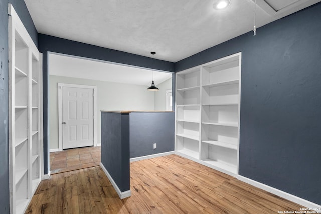214 Loretta Pl, San Antonio, TX 78210 - spare room featuring wood finished floors, baseboards, attic access, and recessed lighting