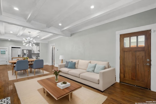 living room with beamed ceiling, dark wood-type flooring, and a notable chandelier