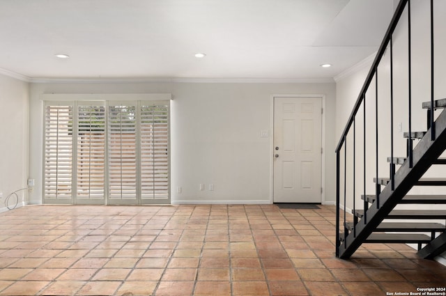 foyer featuring crown molding