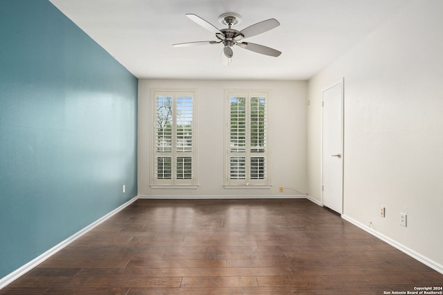 unfurnished room featuring ceiling fan and dark hardwood / wood-style flooring