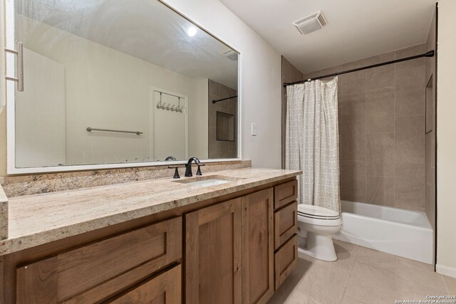 full bathroom with vanity, toilet, shower / bath combination with curtain, and tile patterned flooring