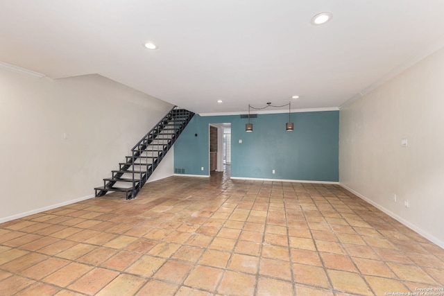 unfurnished living room with crown molding and light tile patterned floors