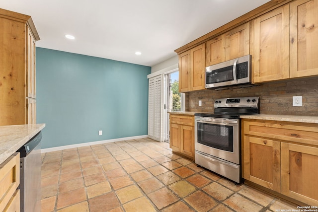 kitchen featuring appliances with stainless steel finishes and backsplash