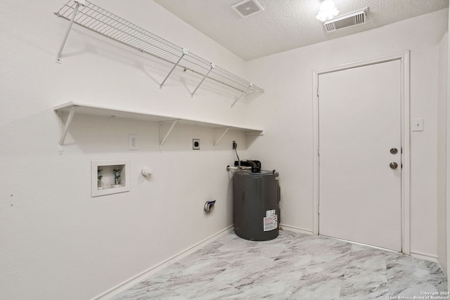 clothes washing area featuring a textured ceiling, hookup for a washing machine, water heater, hookup for a gas dryer, and hookup for an electric dryer