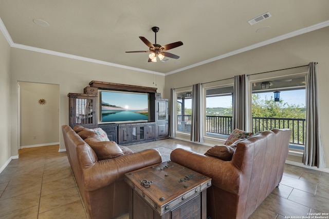 living room featuring a wealth of natural light, ornamental molding, light tile patterned flooring, and ceiling fan