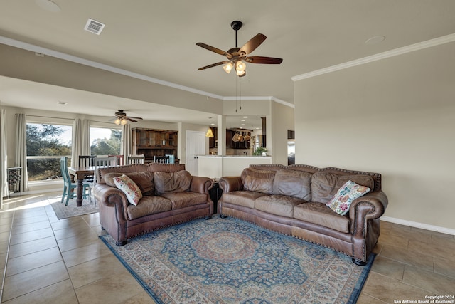 living room featuring ceiling fan, ornamental molding, and light tile patterned flooring