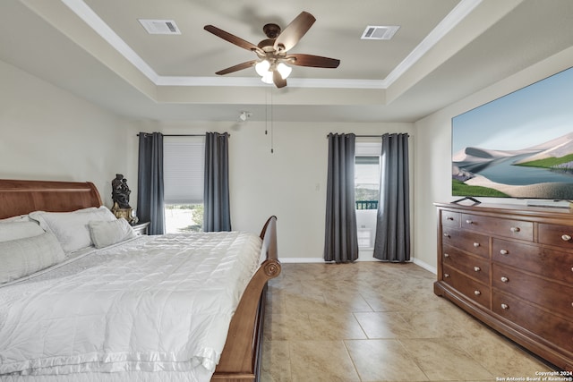 bedroom featuring crown molding, light tile patterned floors, a tray ceiling, and ceiling fan