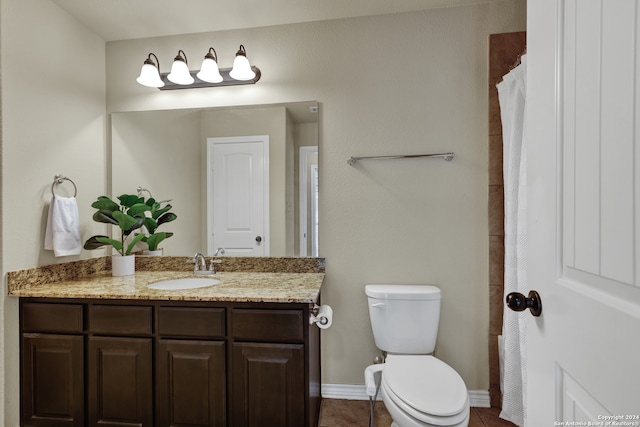 bathroom featuring vanity, toilet, a shower with curtain, and tile patterned flooring