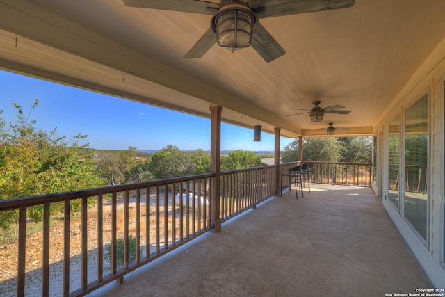 view of patio featuring ceiling fan