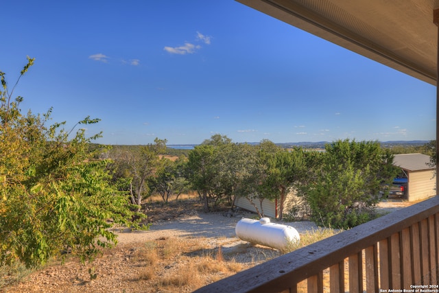 view of yard with a balcony