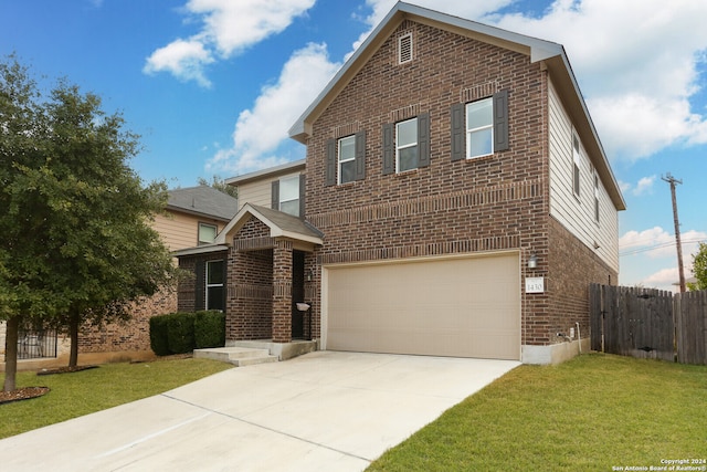 view of front of property with a garage and a front lawn