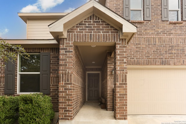 doorway to property featuring a garage