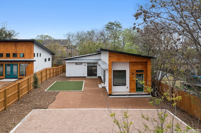 back of house with a patio area