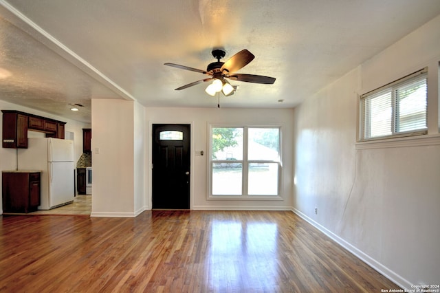 interior space with hardwood / wood-style flooring and ceiling fan